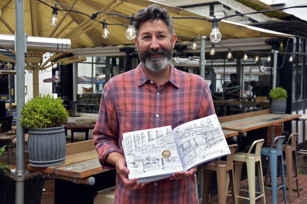 man with Colouring book