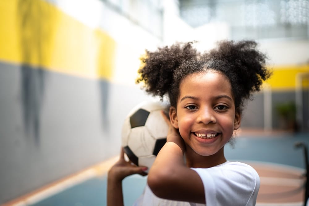 little girl with football
