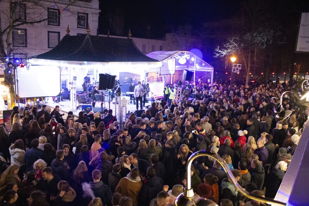 Thousands see in the New Year with a hug. Photography by Jude Moore