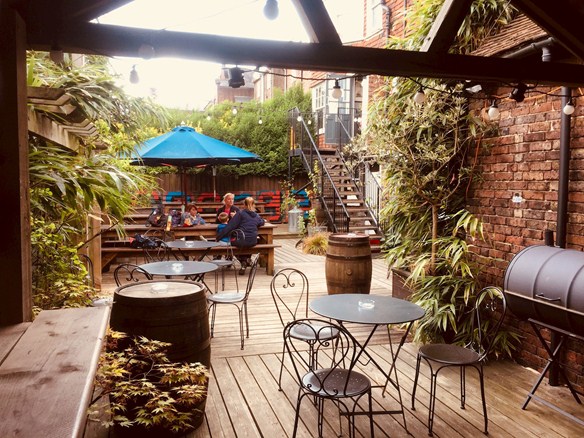The George has a secluded, relaxed beer garden to enjoy.