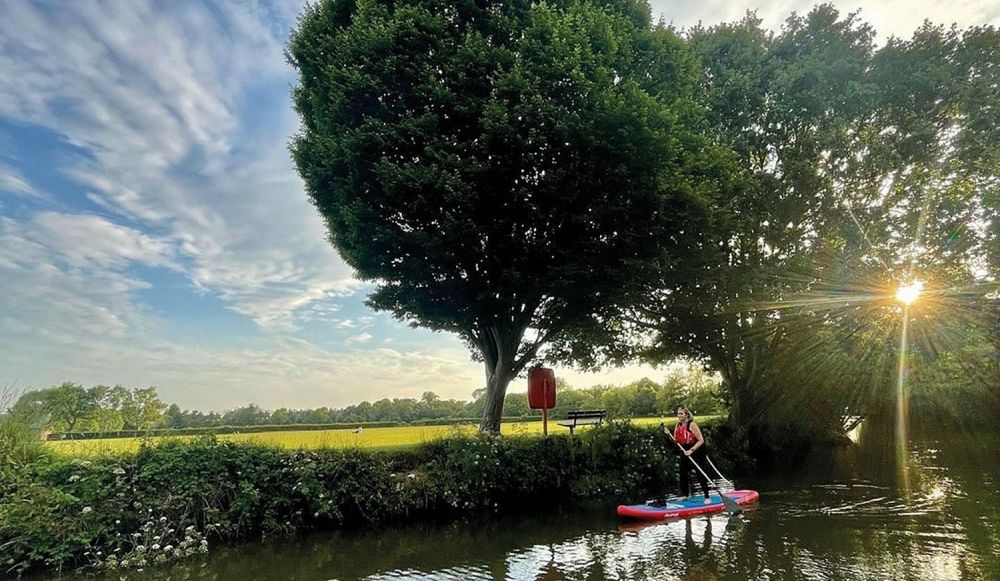 Woman riding sup on a river