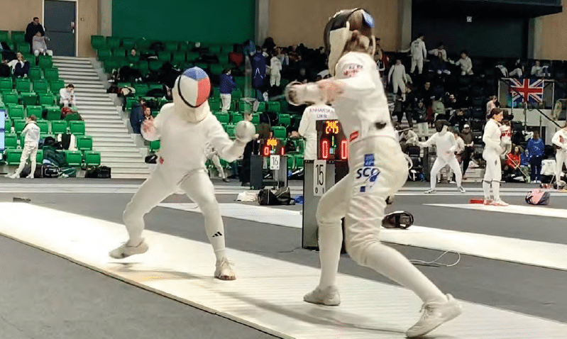 Two fencers in competition